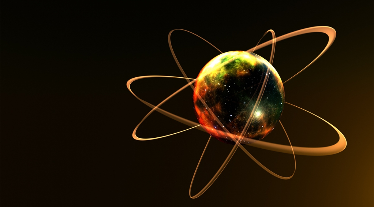 An artists's rendering of an atom with galaxies embedded inside