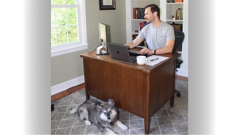 A photo of Laird Egan at a desk