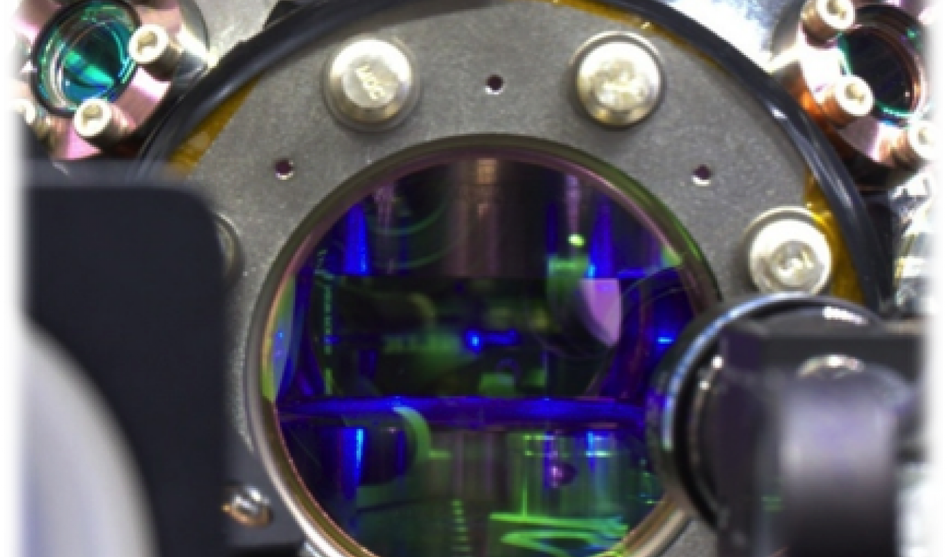 view of a strontium MOT through a vacuum chamber