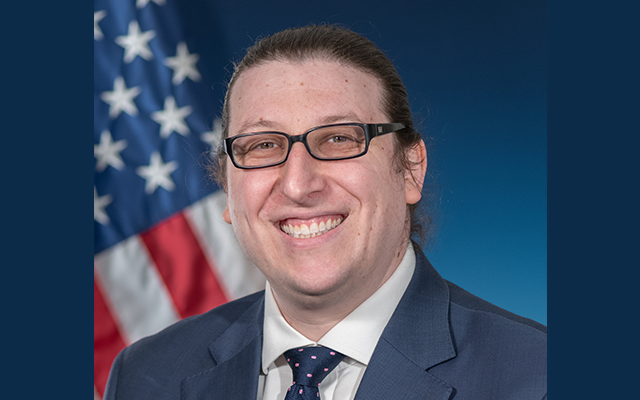 Man in front of american flag