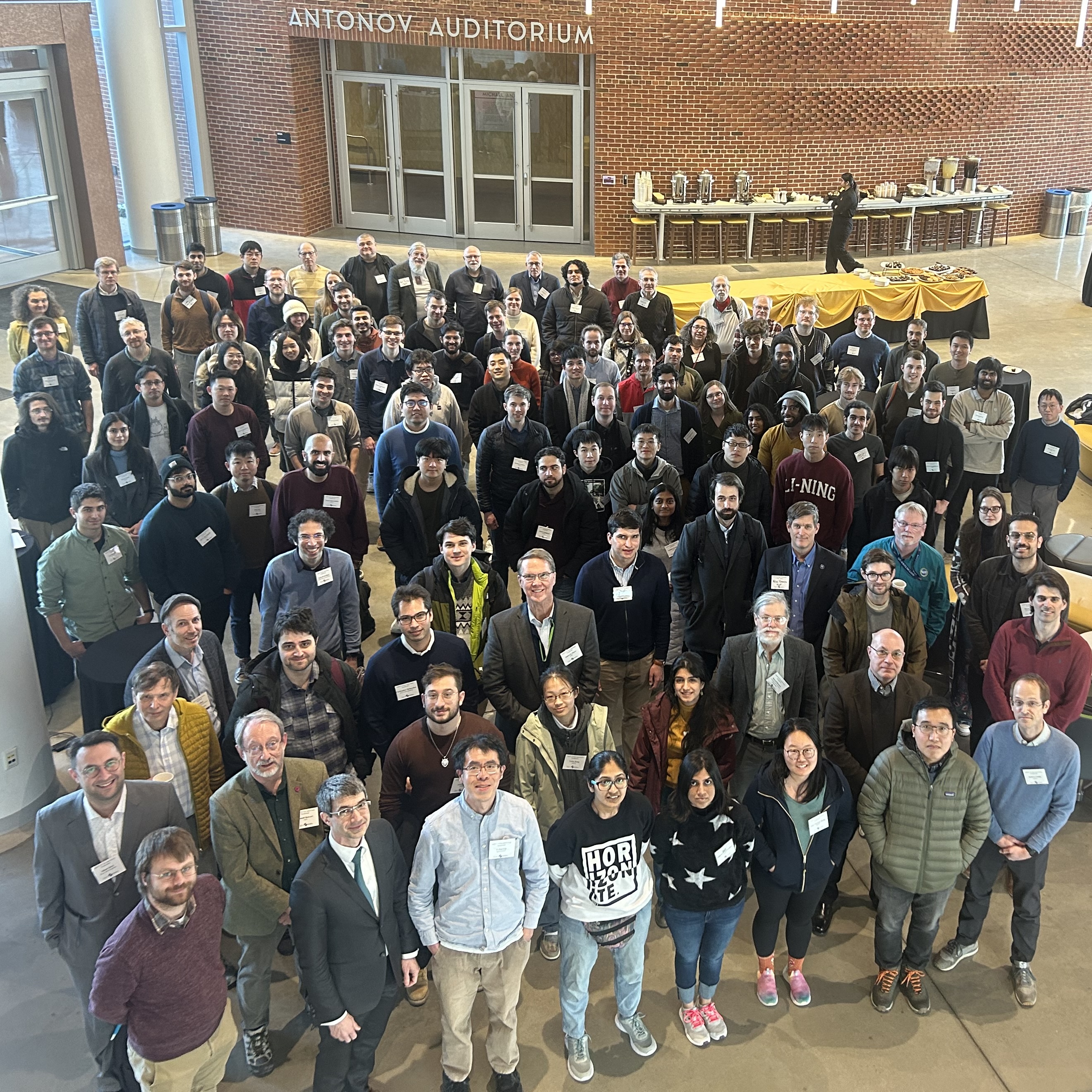 A photo of a large group of people affiliated with QuICS.